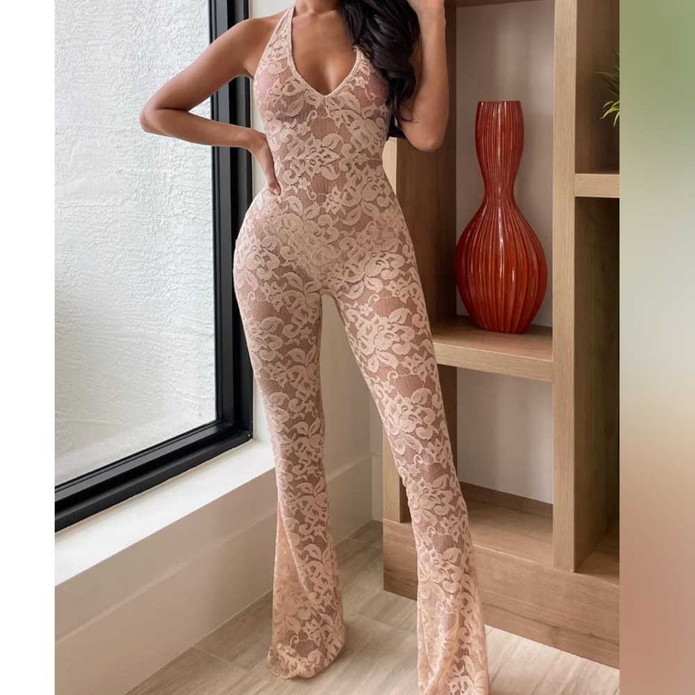 Sexy see through jumpsuit with flare at the bottom. Never worn